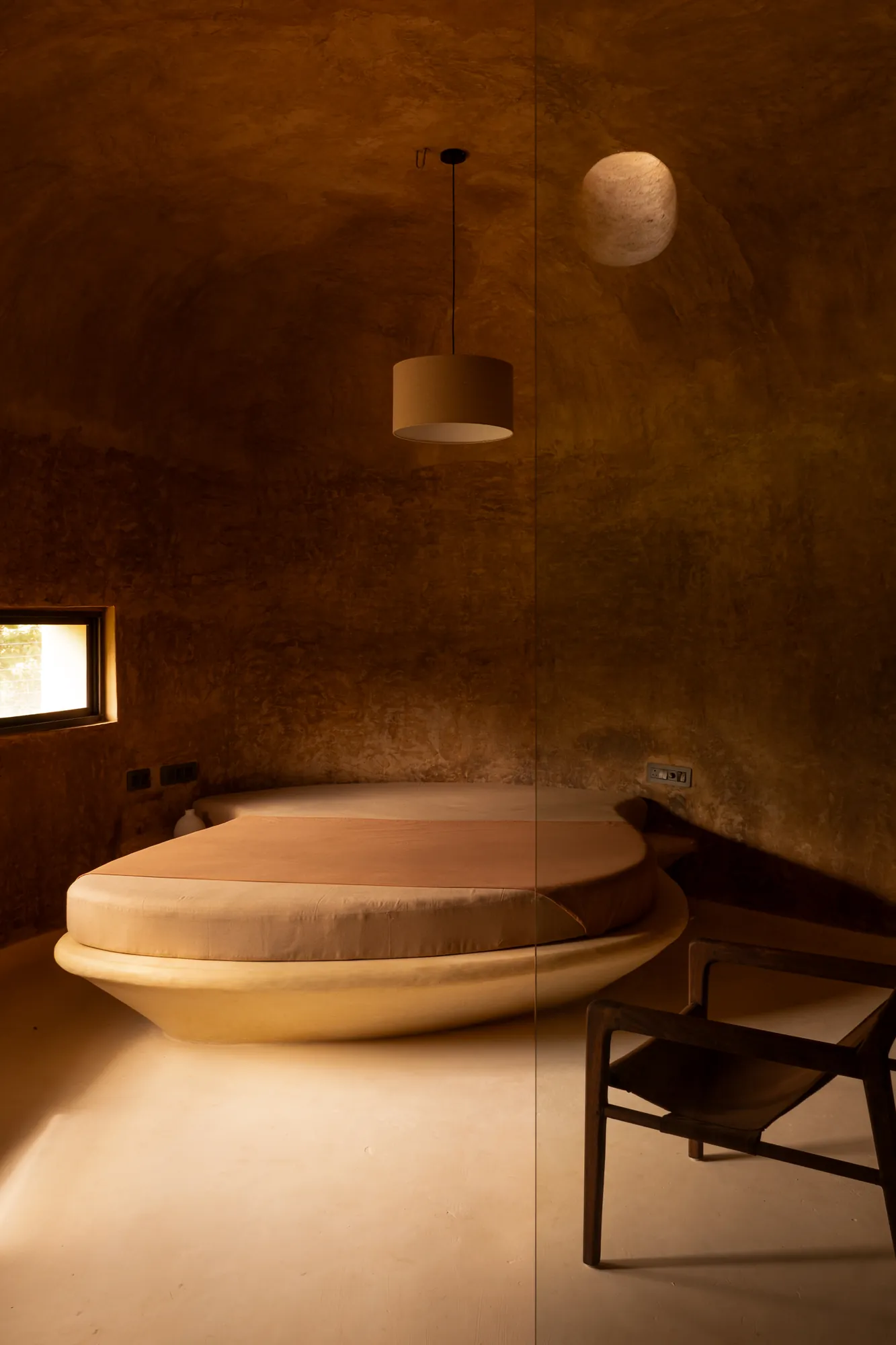 A round bed shaped to the room