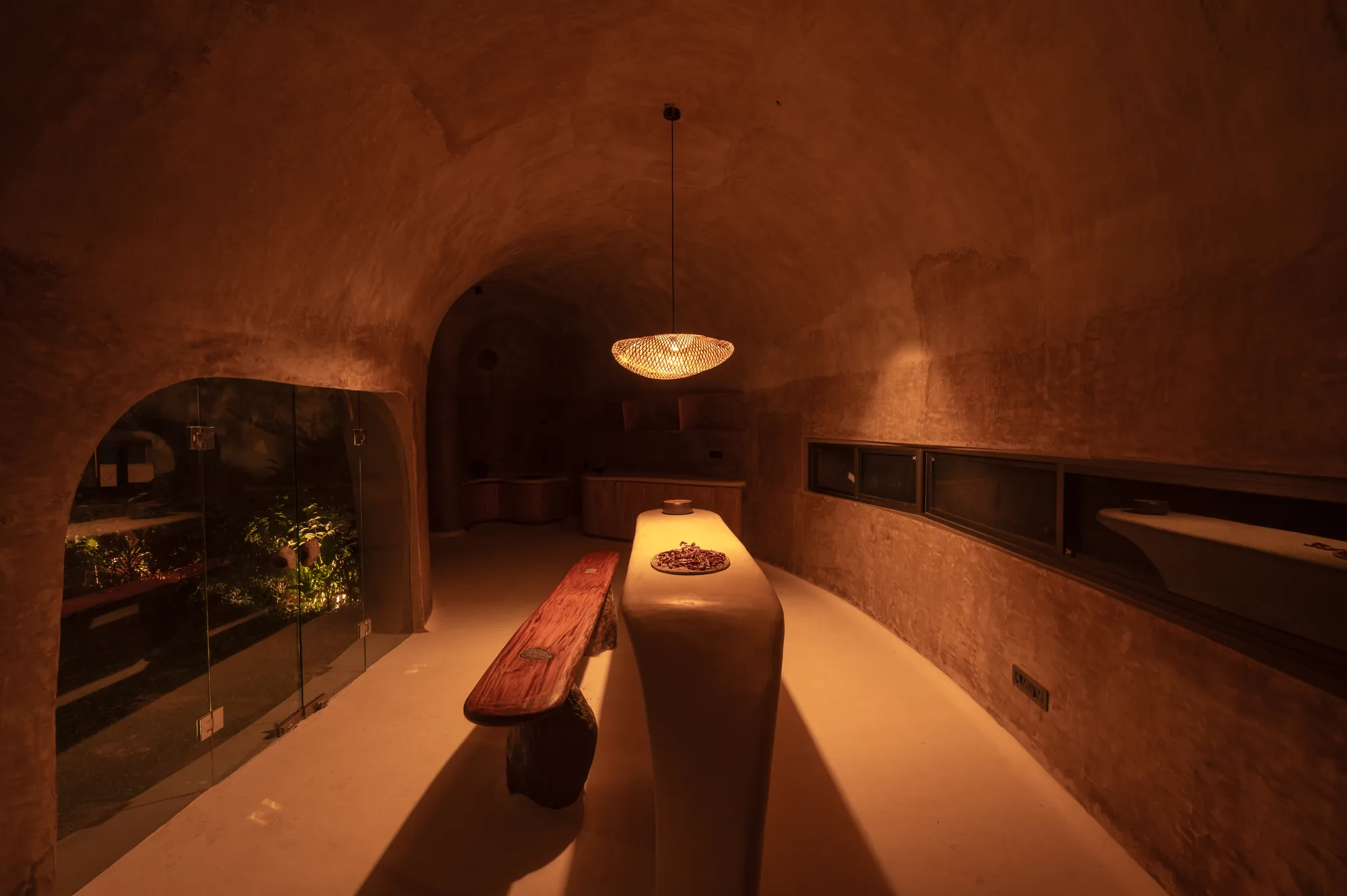 The bar counter, with a linear window to the palms
