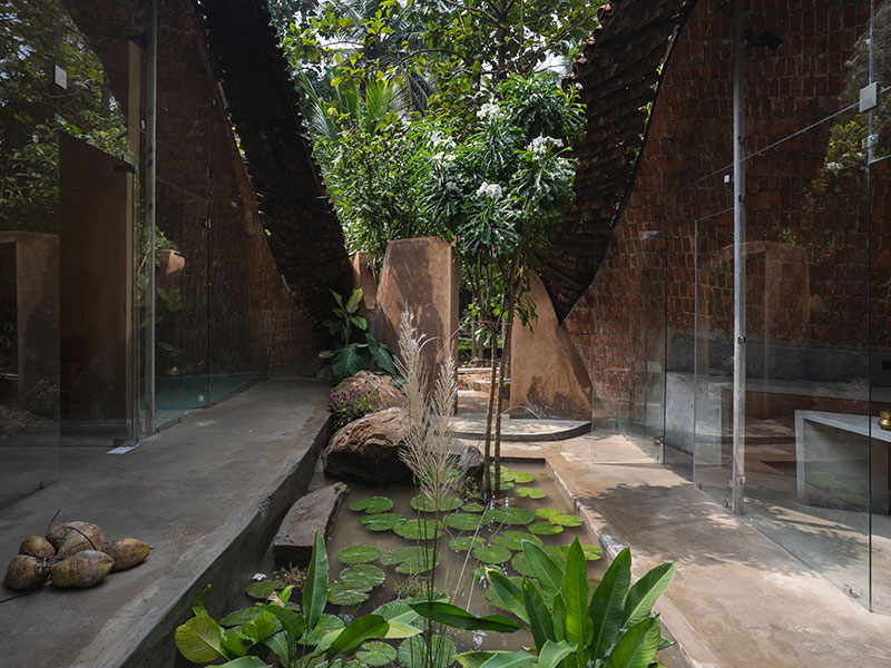 Poured earth wall texture and reclaimed wood fenestrations